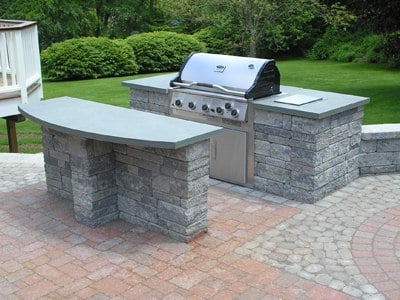 Outdoor Kitchen with Built-in Grill and Serving Island