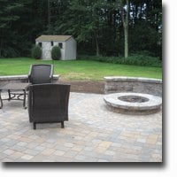 Patio with sitting walls and fire pit