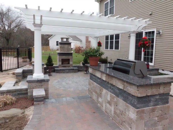 Outdoor Living with Paver patio, pergola, fire place, and outdoor grill
