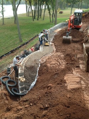 retaining wall installation compaction backfill drainage