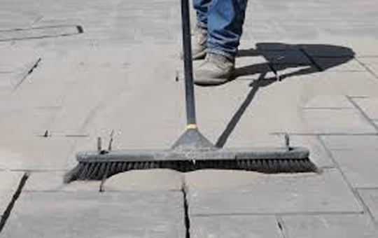 sweep poly sand into the paver joints