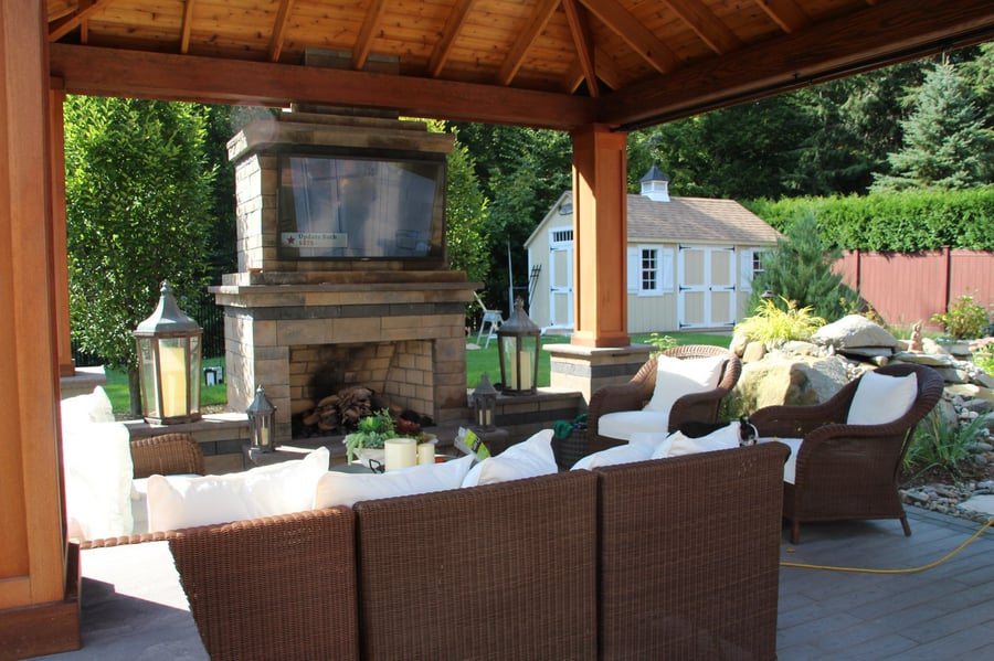 Covered patio with fireplace and sitting area